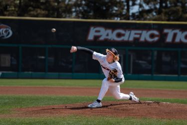 Pacific baseball player pitches the ball.