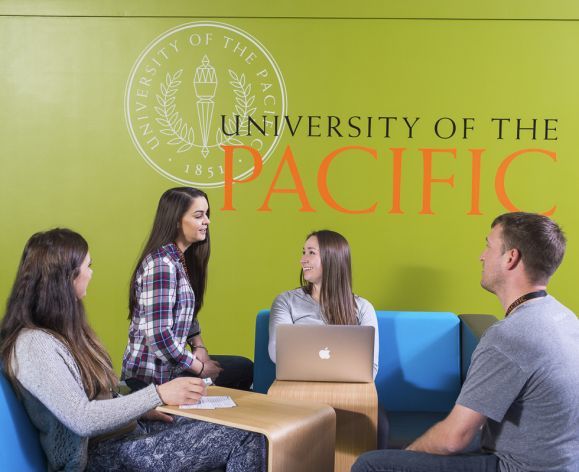 students looking at laptop