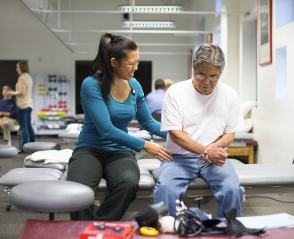 student working with patient