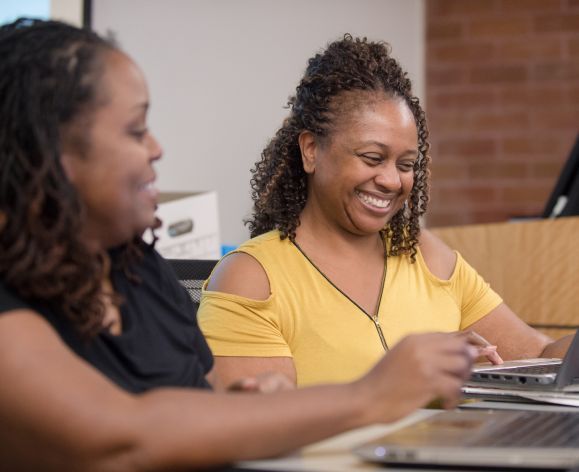 students looking at laptop